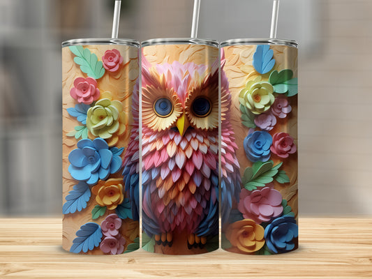 Owl tumbler with colorful floral accents and straw.