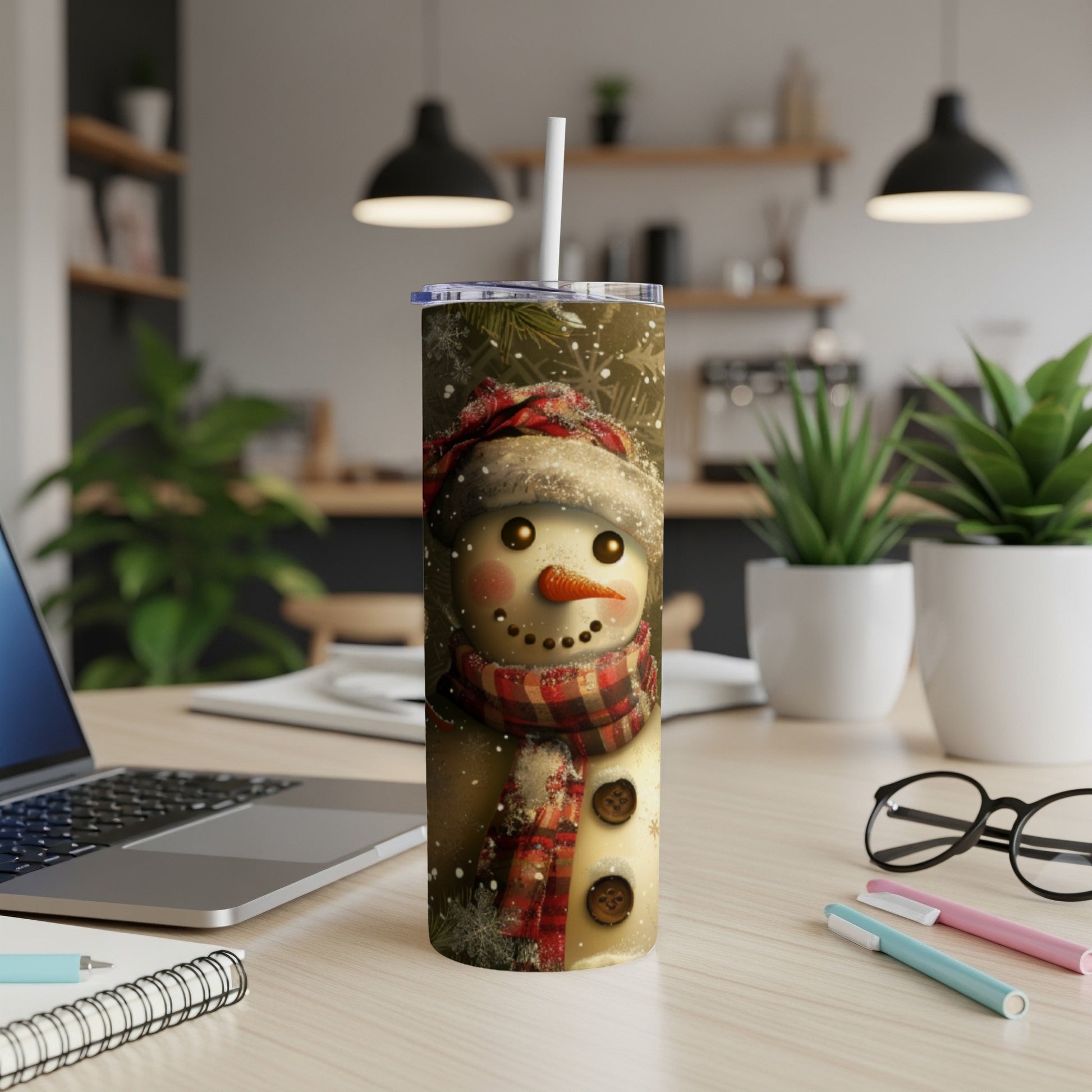 Snowman wearing a scarf and hat with snowflakes on a tumbler.