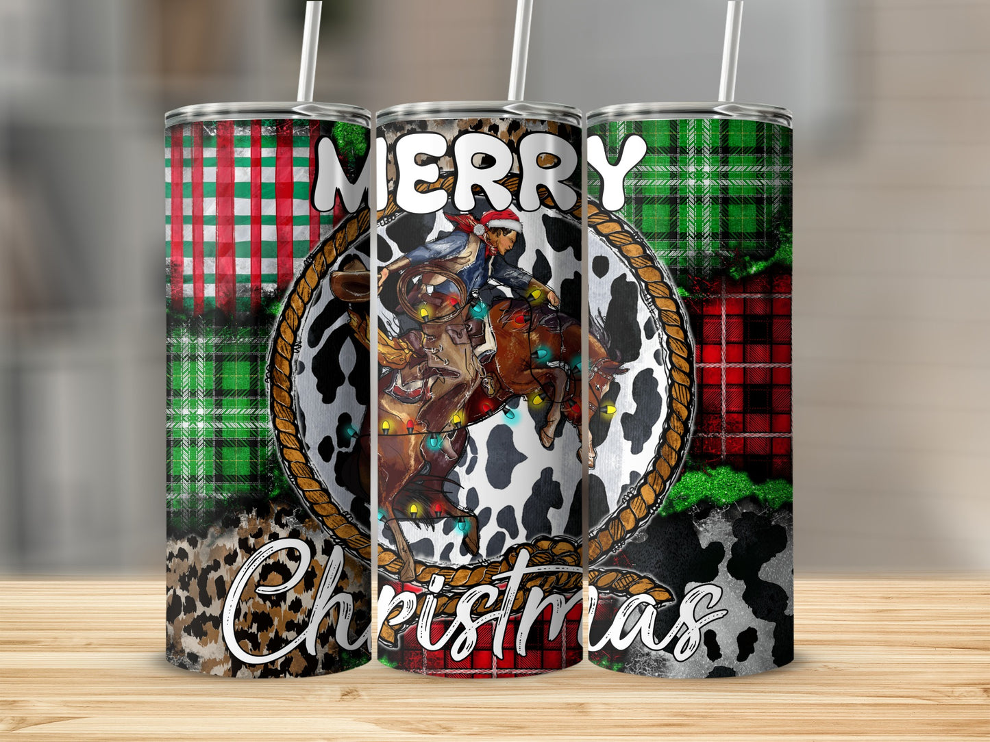 Tumbler with cowboy on horse, Merry Christmas text, and plaid/animal print patterns.