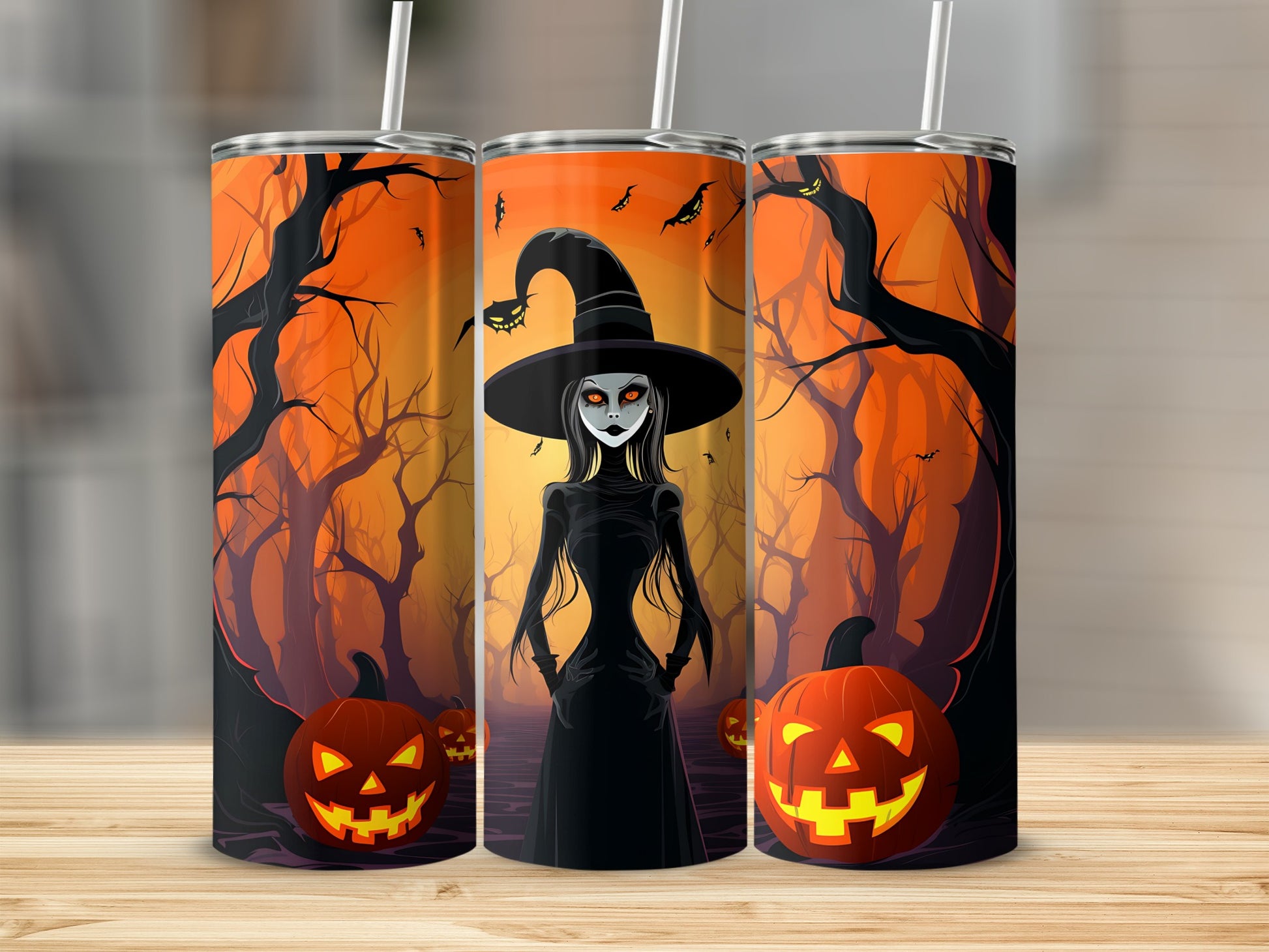 Three tumblers with Halloween theme: witch, pumpkins, and spooky trees.