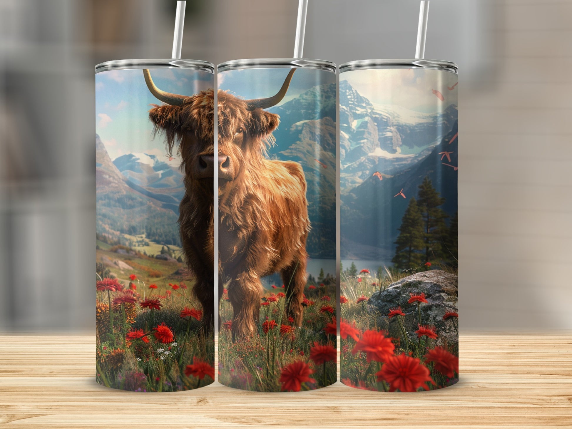 Highland cow in a field of red wildflowers with mountains in background.