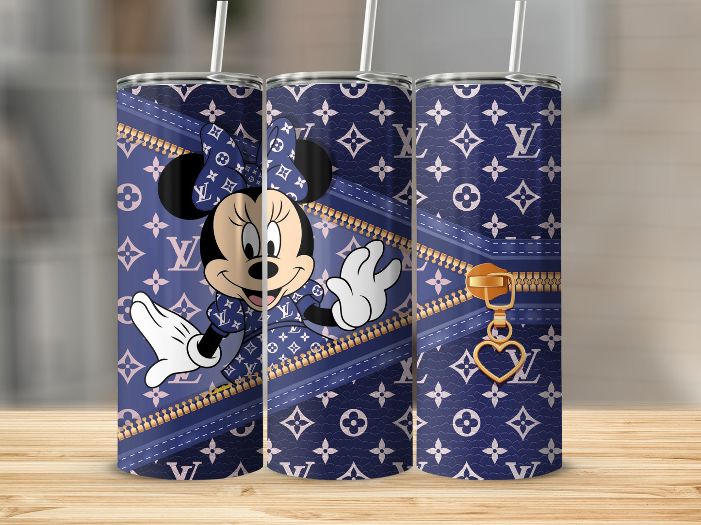 Minnie Mouse on navy blue LV-patterned tumbler with gold zipper and heart charm.