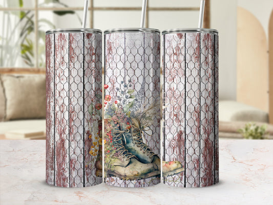 Three tumblers with a distressed wood and chicken wire design featuring a floral boot.
