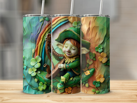 Leprechaun playing a harp next to a rainbow and shamrocks on a tumbler.