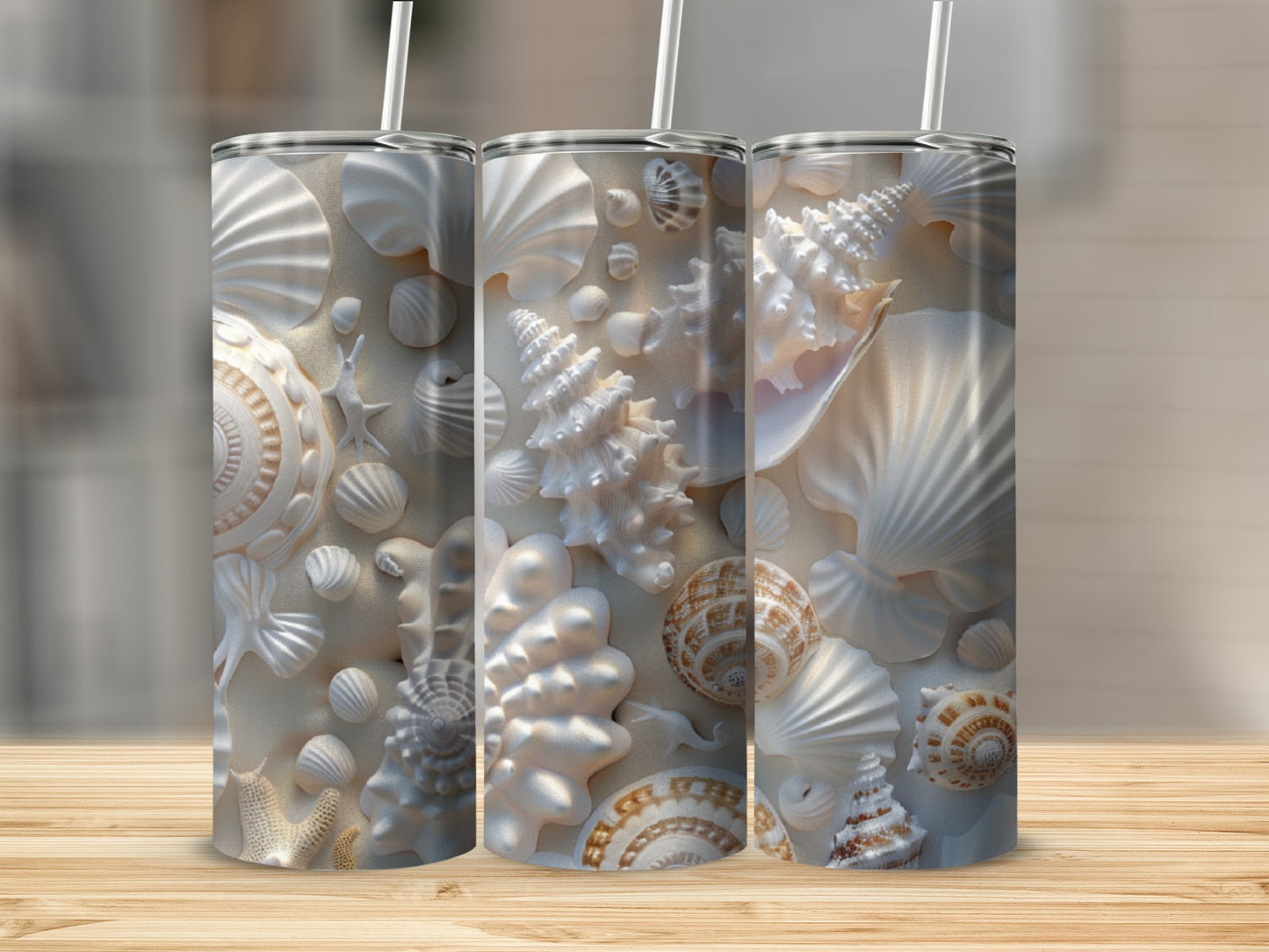 Three tumblers with a detailed seashell and starfish pattern.