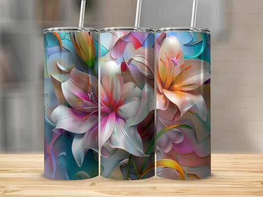 Three tumblers with a vibrant floral lily design sit on a wooden surface.