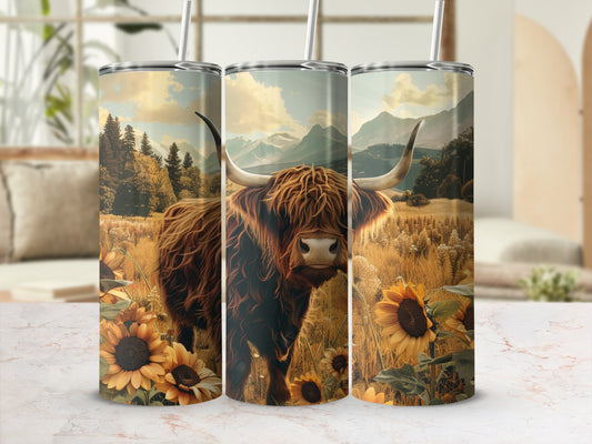 Highland cow and sunflowers on a patterned tumbler with mountain landscape background.