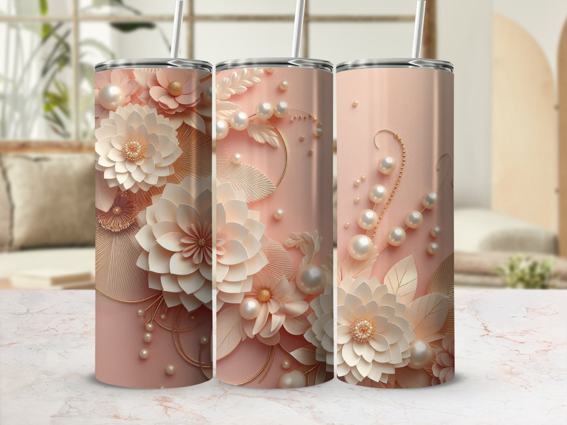 Three pink tumblers with raised floral and pearl designs and straws.