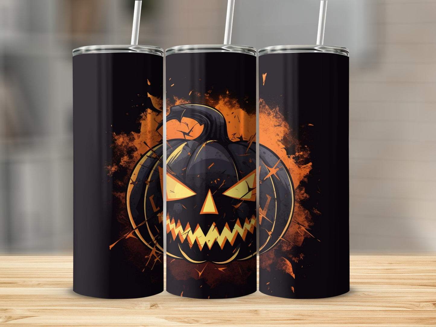 Three tumblers featuring a black, grinning jack-o'-lantern with glowing orange eyes.