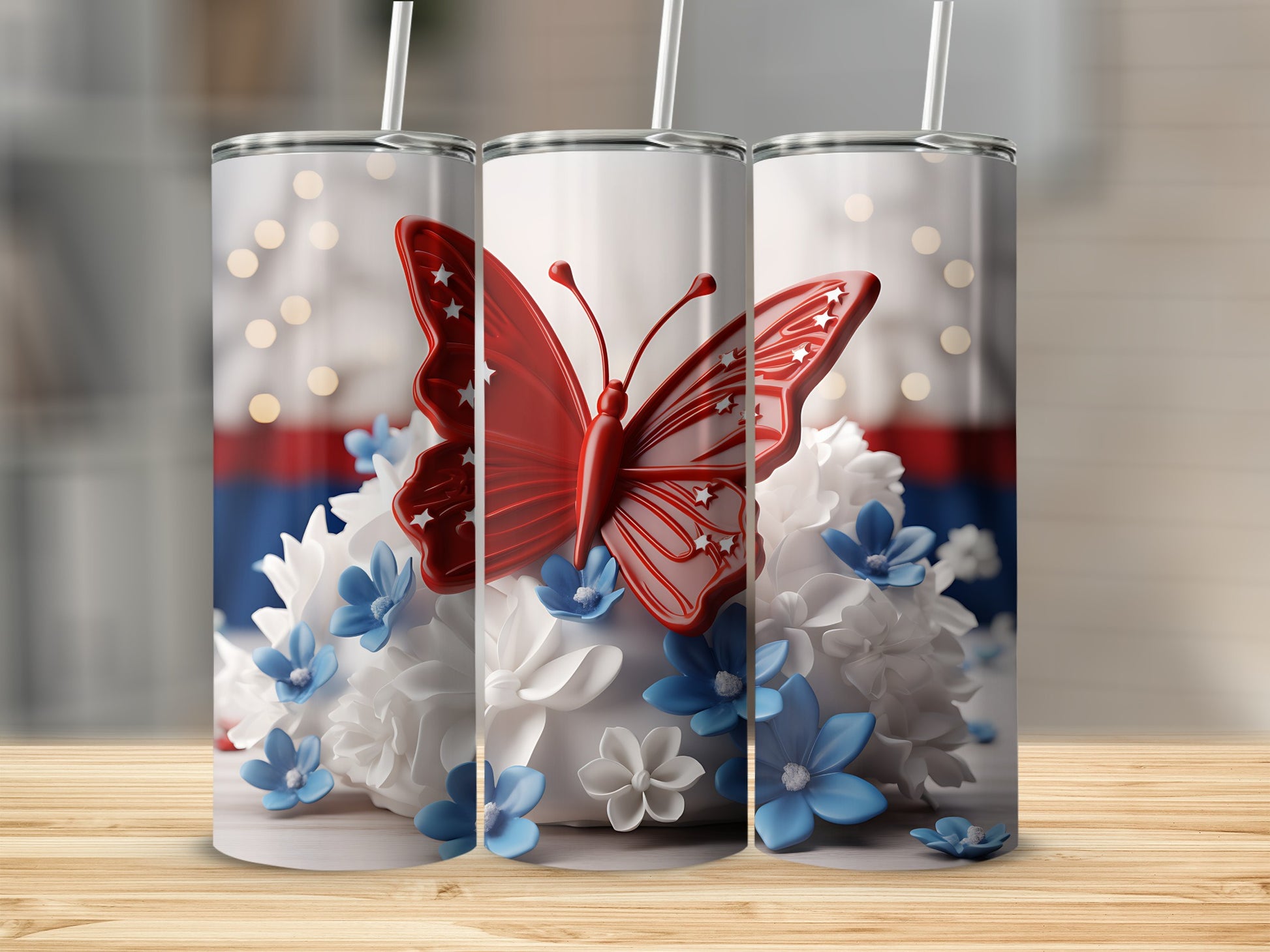 Three white tumblers with red butterfly and floral design on a wooden surface.