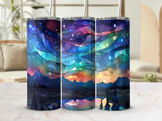 Three tumblers with a colorful cosmic landscape design.