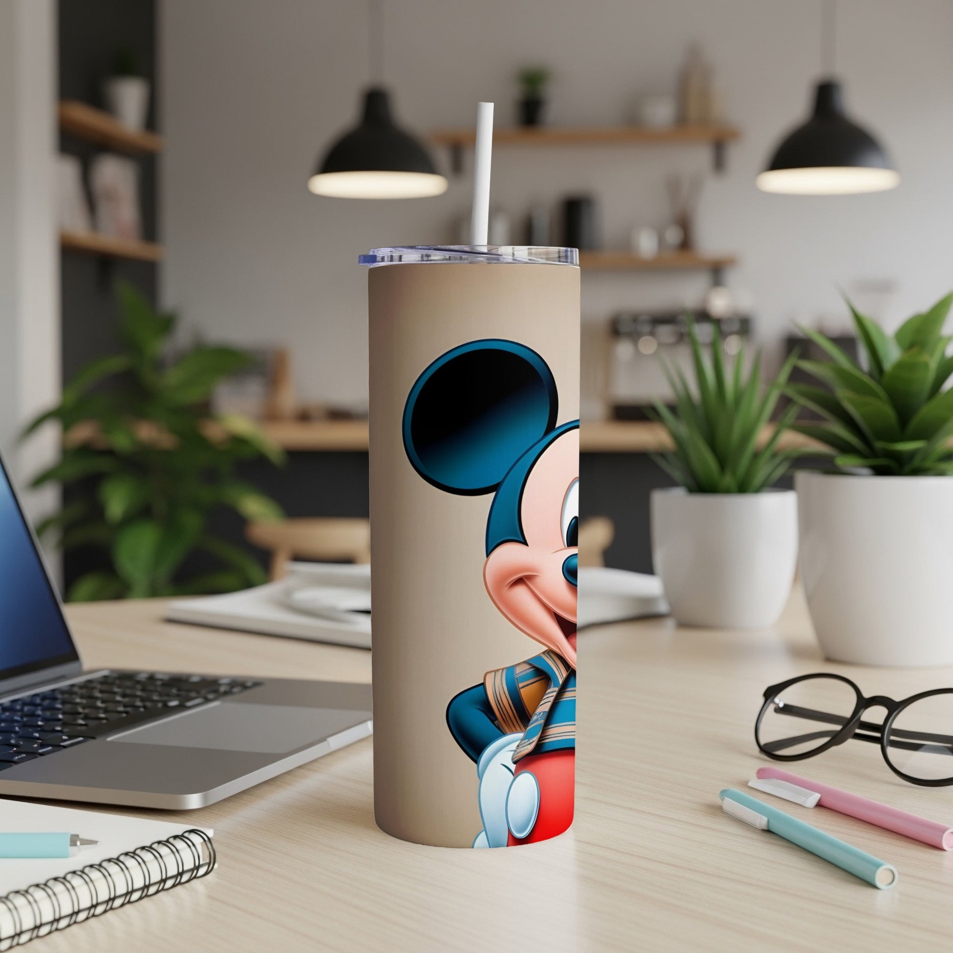 Mickey Mouse wearing a striped shirt on a tan tumbler.
