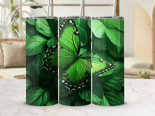 Green butterfly on leaves adorns three stainless steel tumblers with straws.