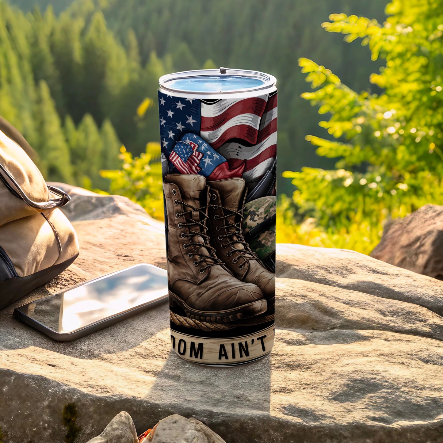 American flag, combat boots, and "Freedom Ain't Free" text on tumbler.
