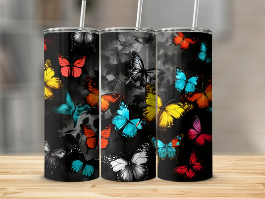 Three tumblers with colorful butterflies on a black background.