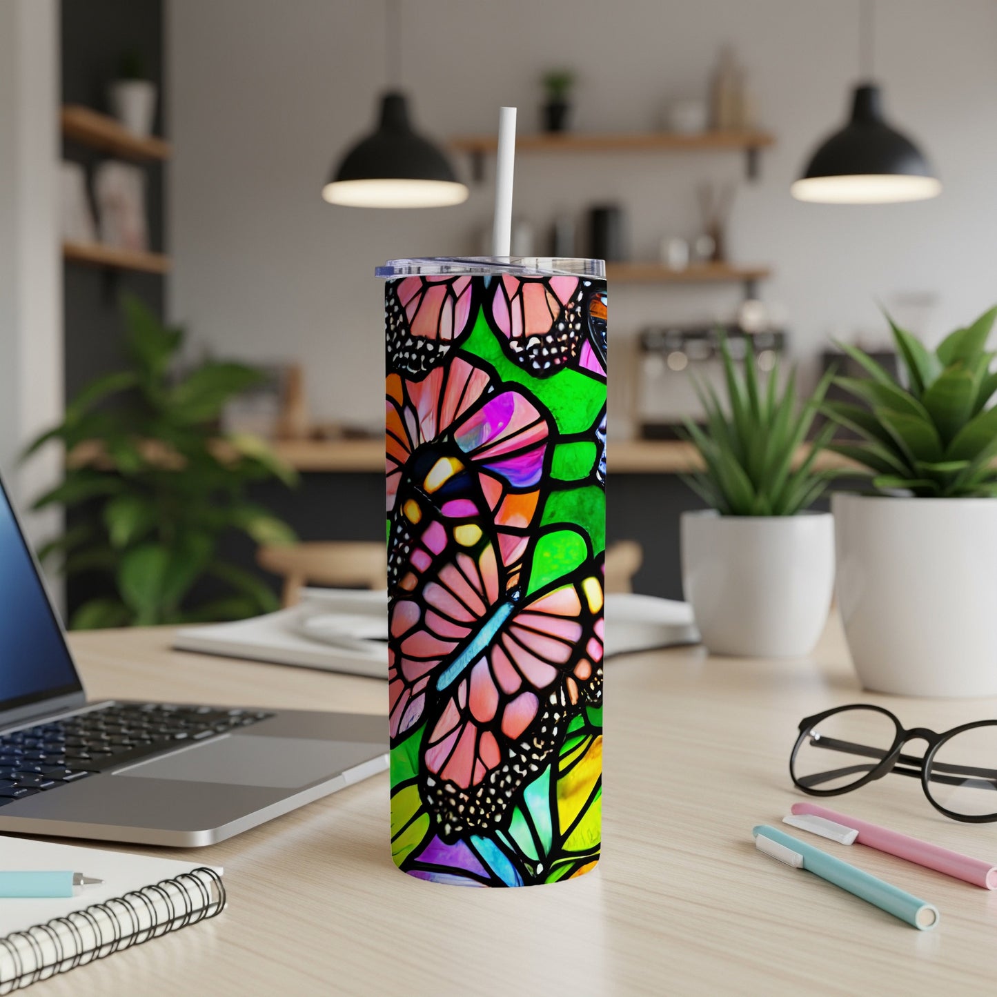 Tall tumbler with colorful butterfly stained glass design.