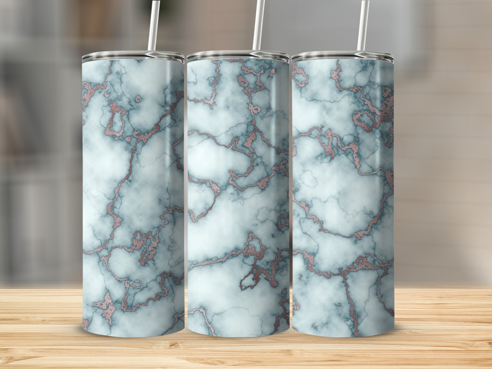 Three tall tumblers with a marbled blue and rose gold design.