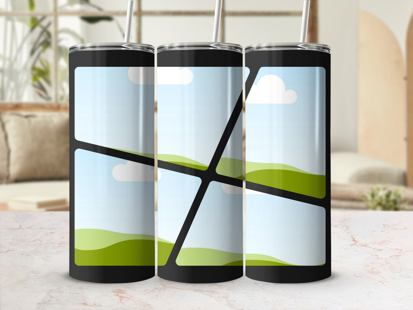 Three black tumblers with straw display a landscape design with sky and rolling green hills.