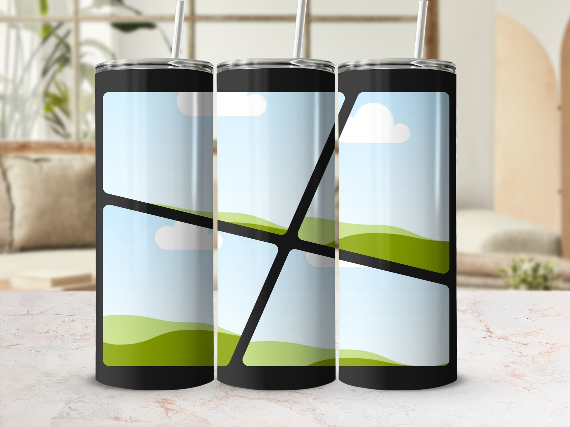 Three black tumblers with straw display a landscape design with sky and rolling green hills.