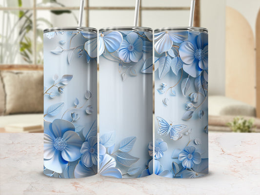 Three tumblers with blue floral designs and a butterfly.