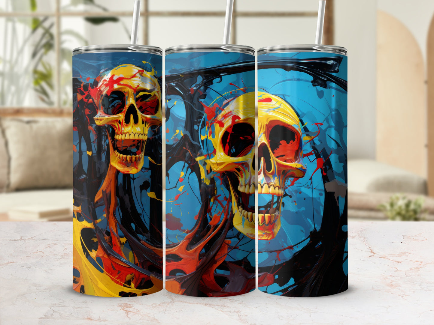 Three tumblers featuring a yellow skull with red and orange paint splashes against a blue background.