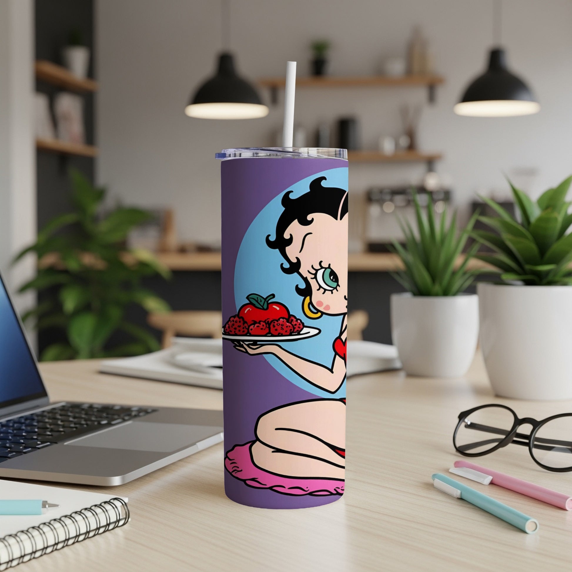 Betty Boop holding a red apple and raspberries on a purple tumbler.