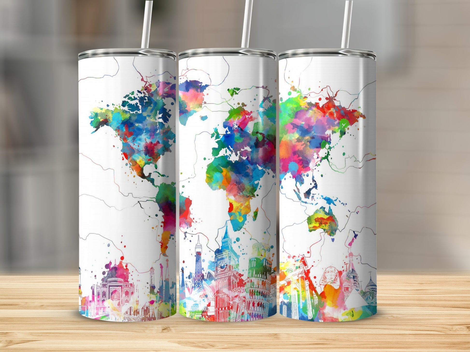Three tumblers with watercolor map of the world and landmarks.