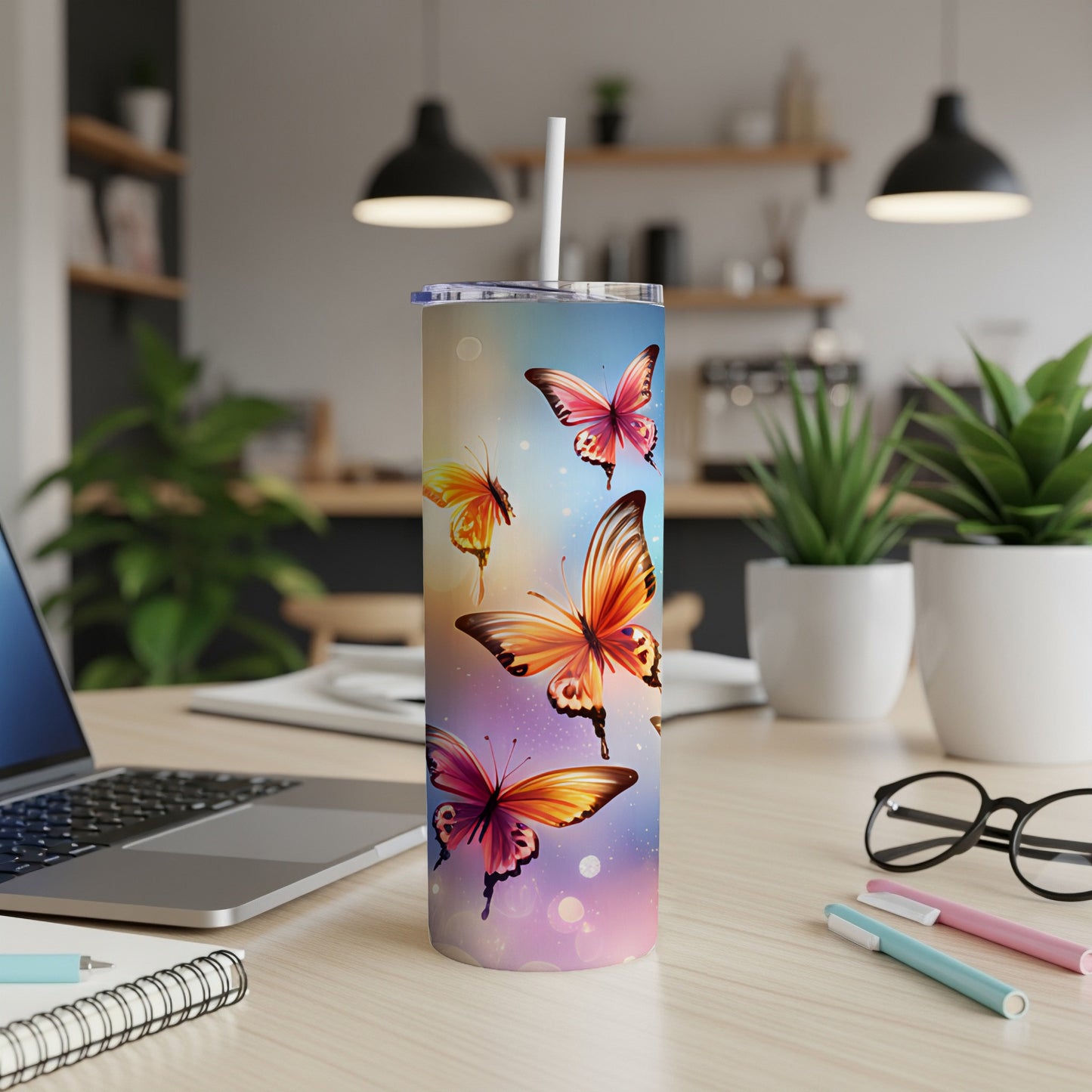 Tumbler with colorful butterflies and gradient background.