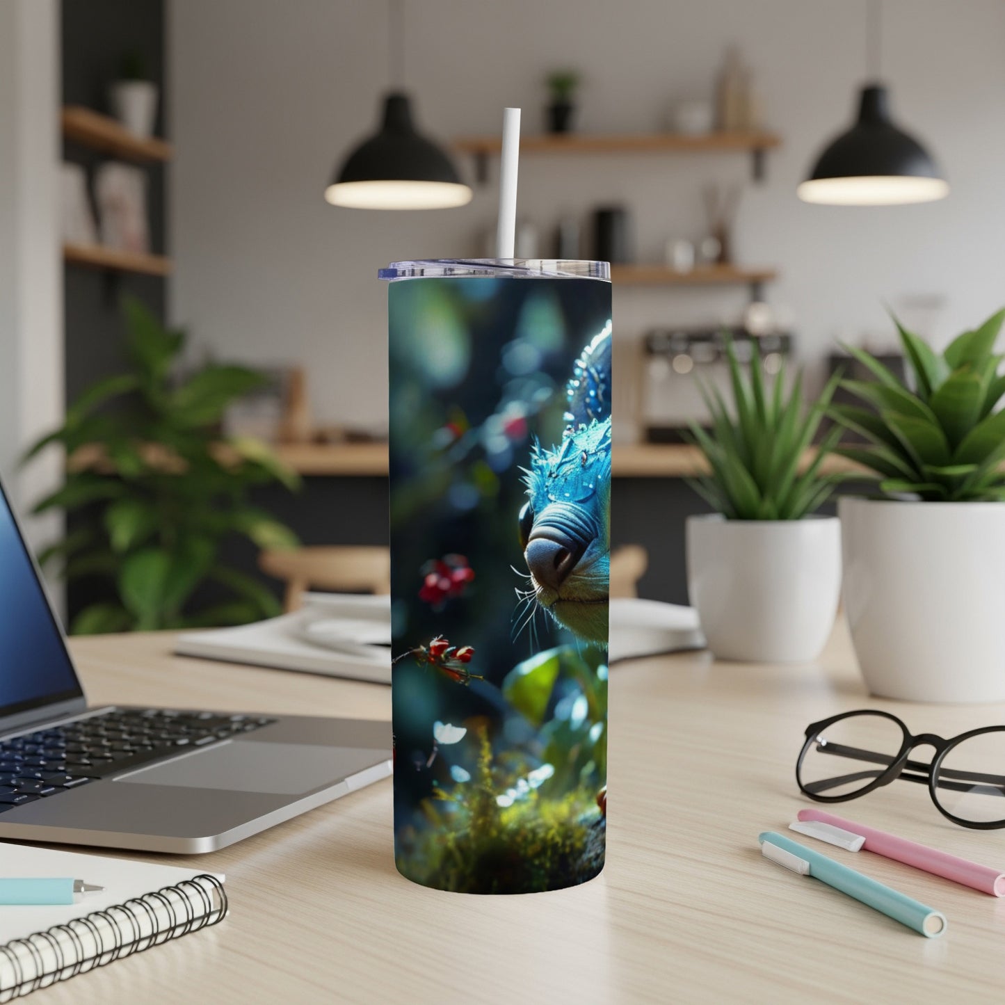 Tumbler with a close-up illustration of a blue-eyed cat among foliage.