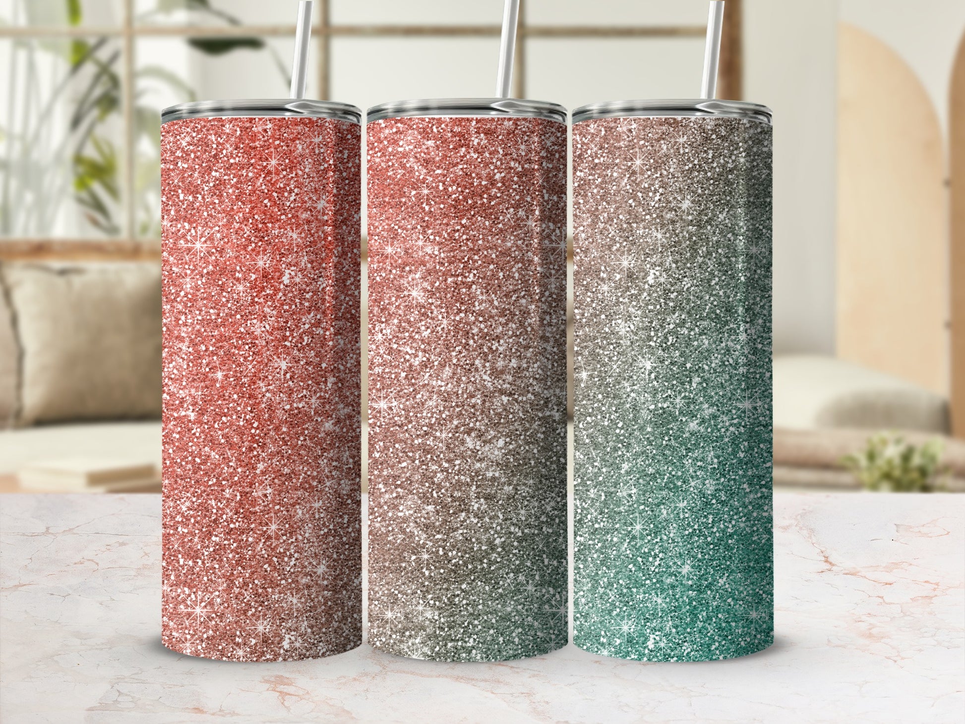 Three glitter tumblers with straws showing ombre effects of coral, brown, and green.