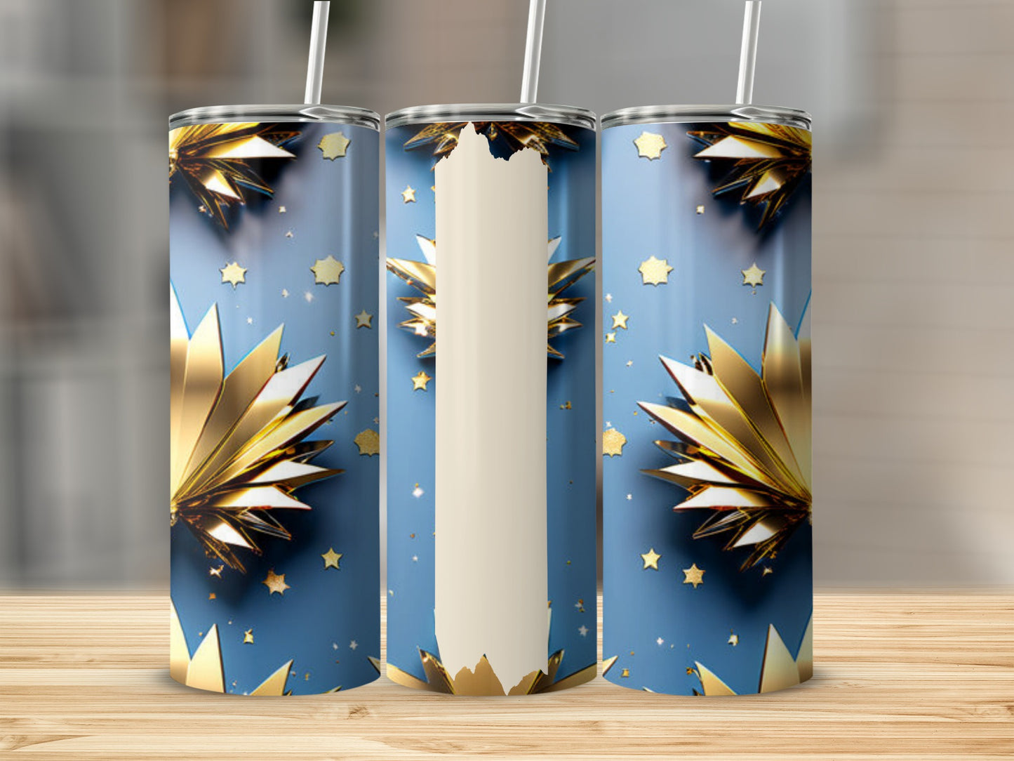 Blue tumbler with gold starbursts and small stars.