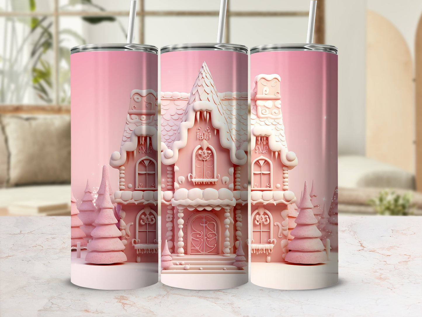 Pink gingerbread house tumbler with snowy trees, framed by a bright room.