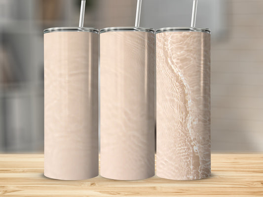 Three blank beige tumblers with straws, two smooth, one with water ripple texture.