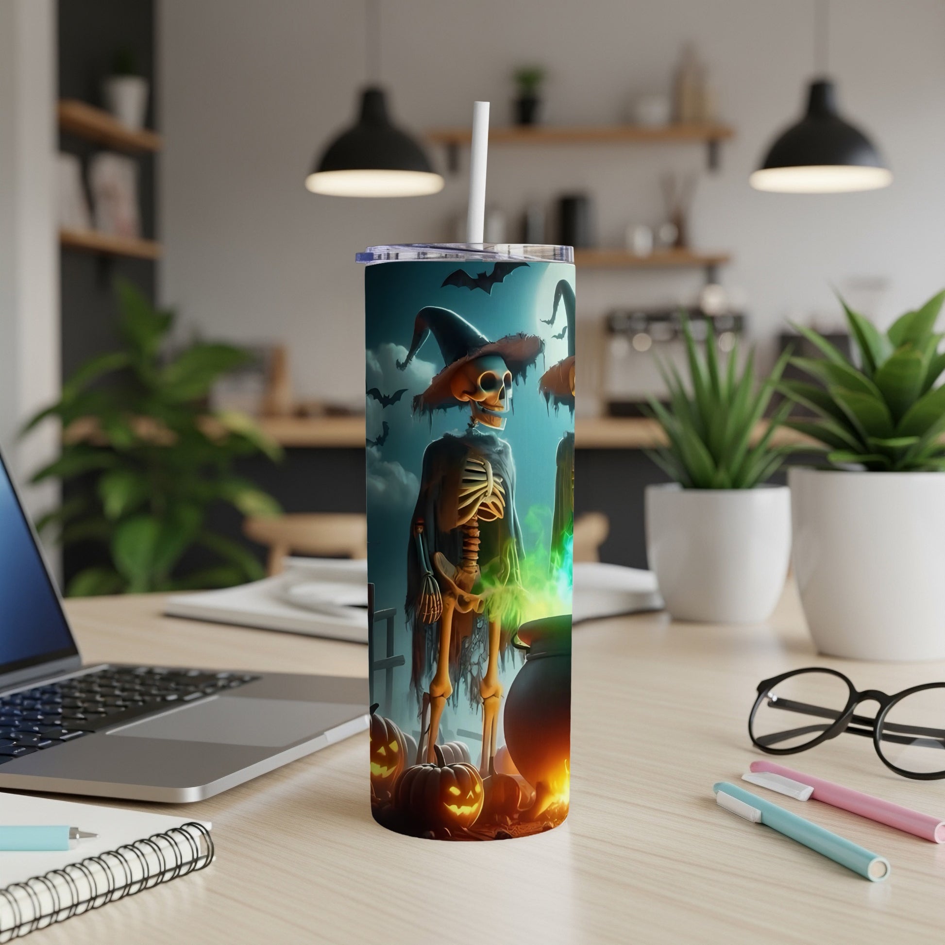 Halloween tumbler with skeleton, witch hat, cauldron, pumpkins, and bats.