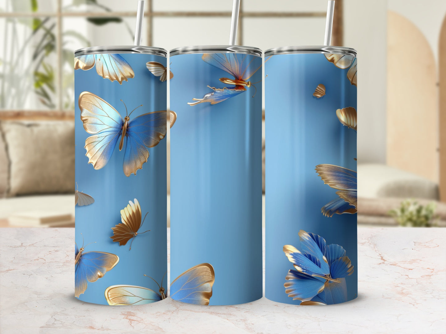 Blue tumbler with gold and blue butterflies.