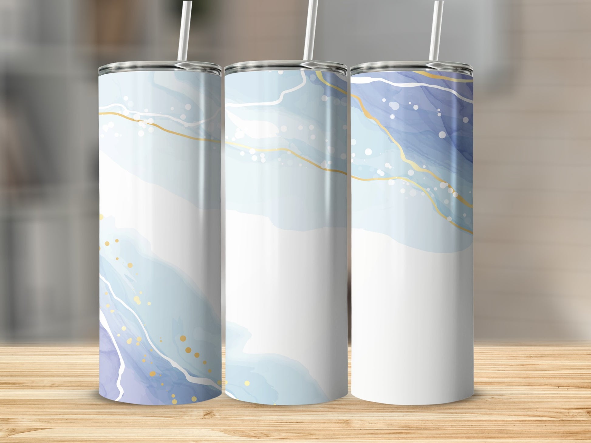 Three tumblers with abstract blue and gold marbled designs.