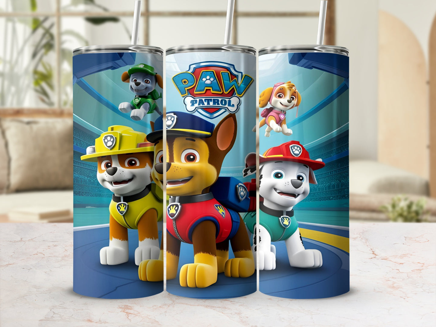 Paw Patrol characters Chase, Marshall, and Skye on tumblers with blue lids and straws.