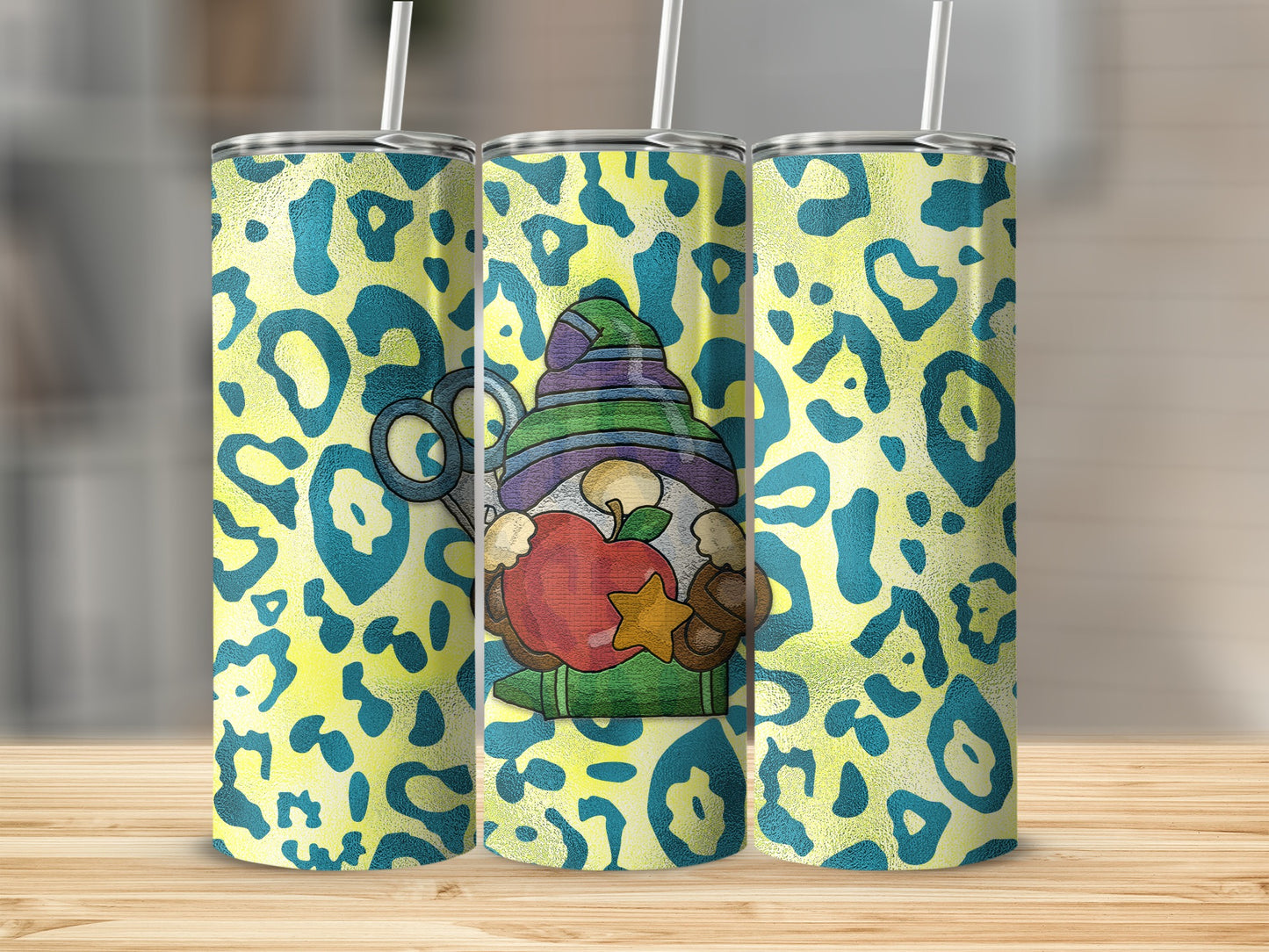 Leopard print tumbler with gnome, apple, and scissors design.