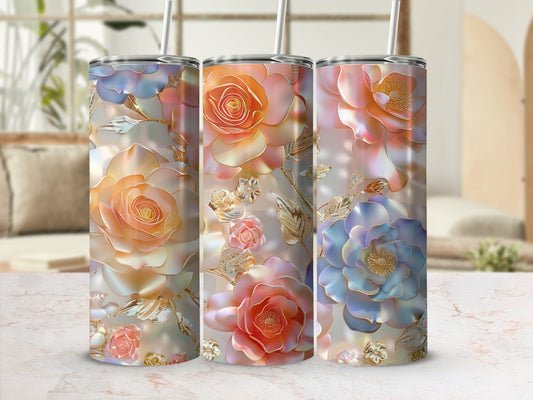 Three tumblers with rose floral designs in pastel colors.