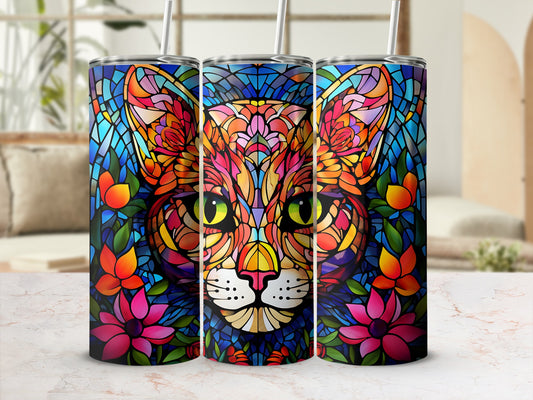 Stained glass cat face with floral accents on a tumbler.