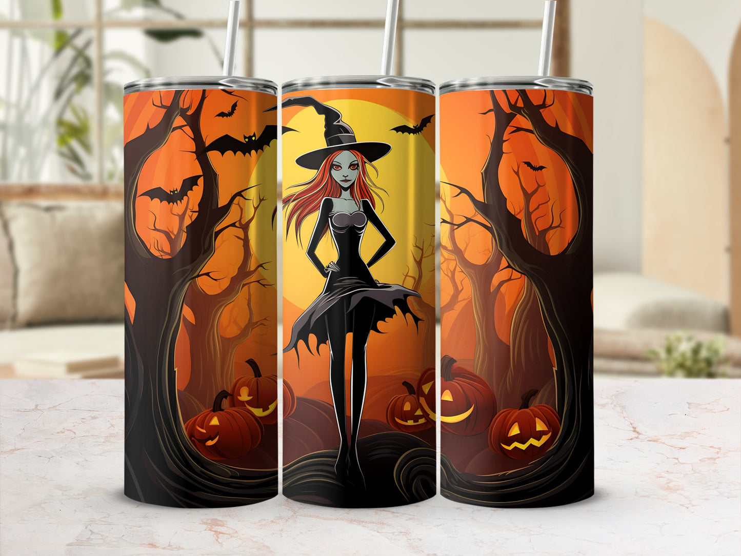 Three tumblers with Halloween witch and pumpkin design on a striped background.