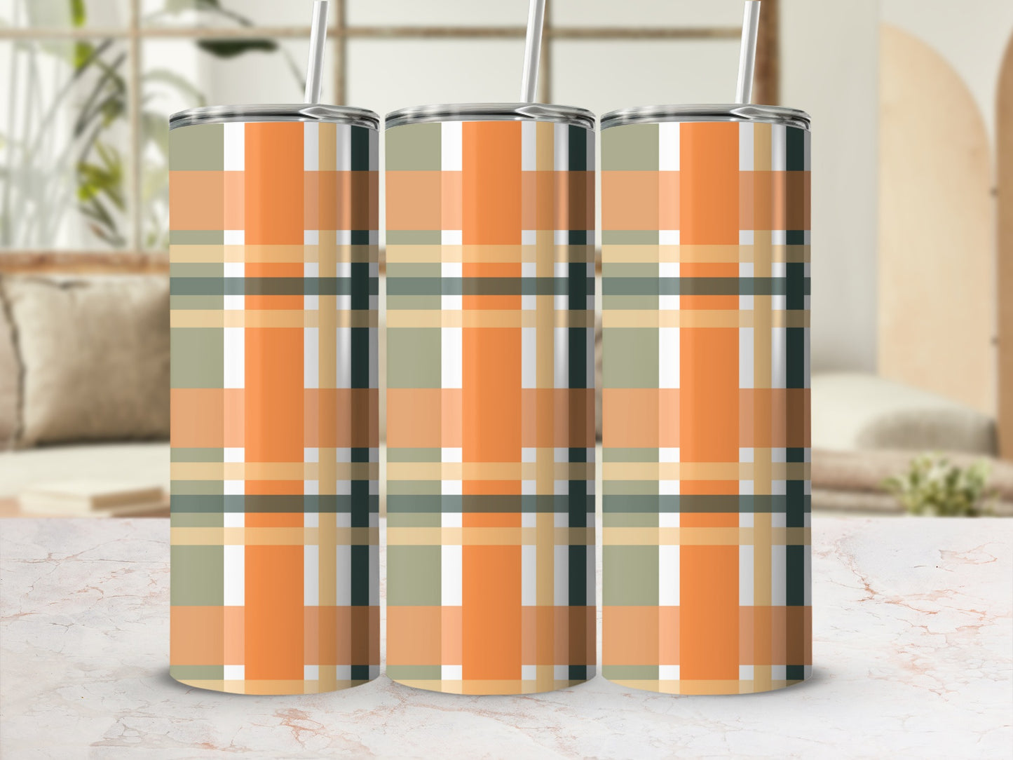 Three tumblers with a green, orange, and beige plaid pattern.