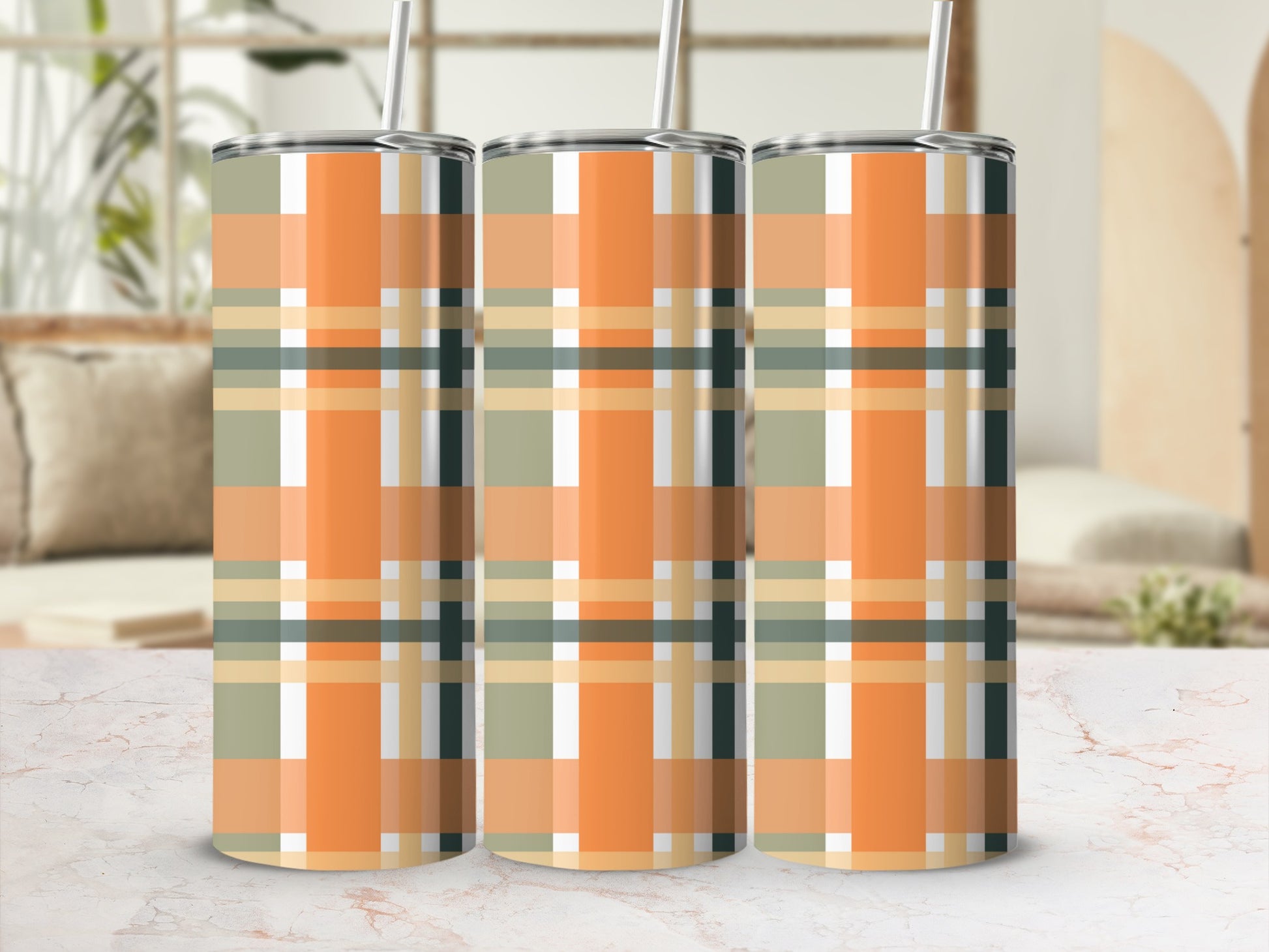 Three tumblers with a green, orange, and beige plaid pattern.