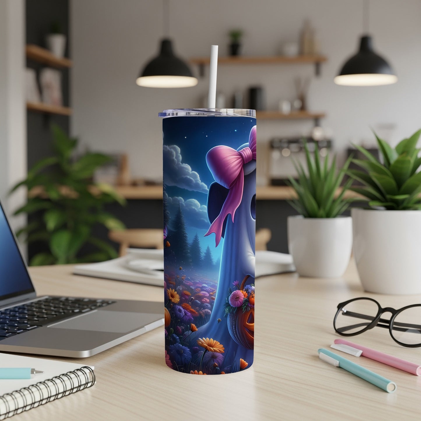 Tumbler with a cute ghost, pink bow, and Halloween flowers at night.