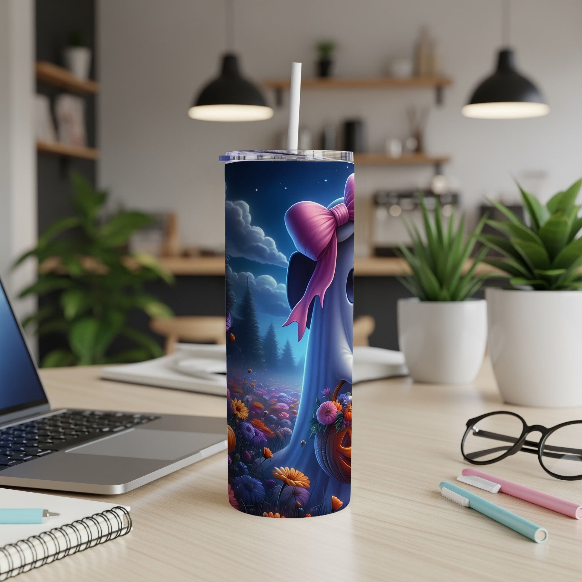 Tumbler with a cute ghost, pink bow, and Halloween flowers at night.