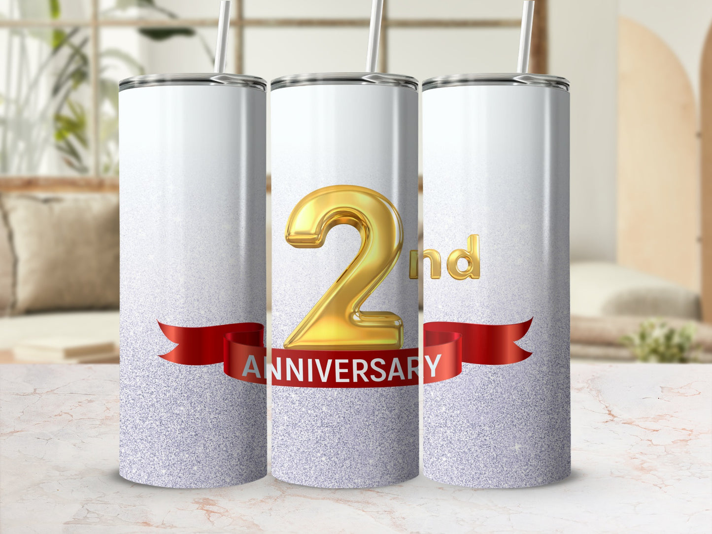 Three glitter-covered tumblers with "2nd Anniversary" text on a red ribbon.
