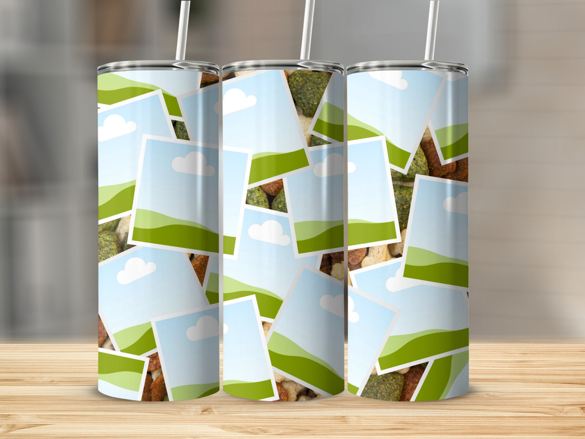 Three tumblers with a collage of green hills and blue skies.