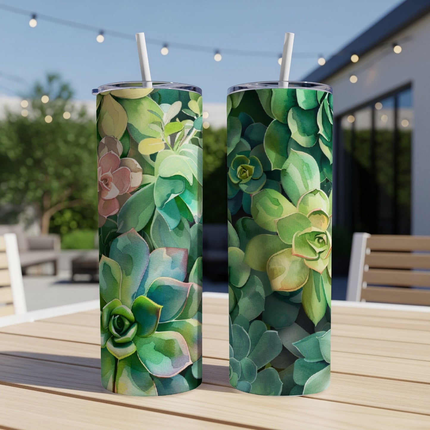 Two tumblers with watercolor succulent design on a wooden table.