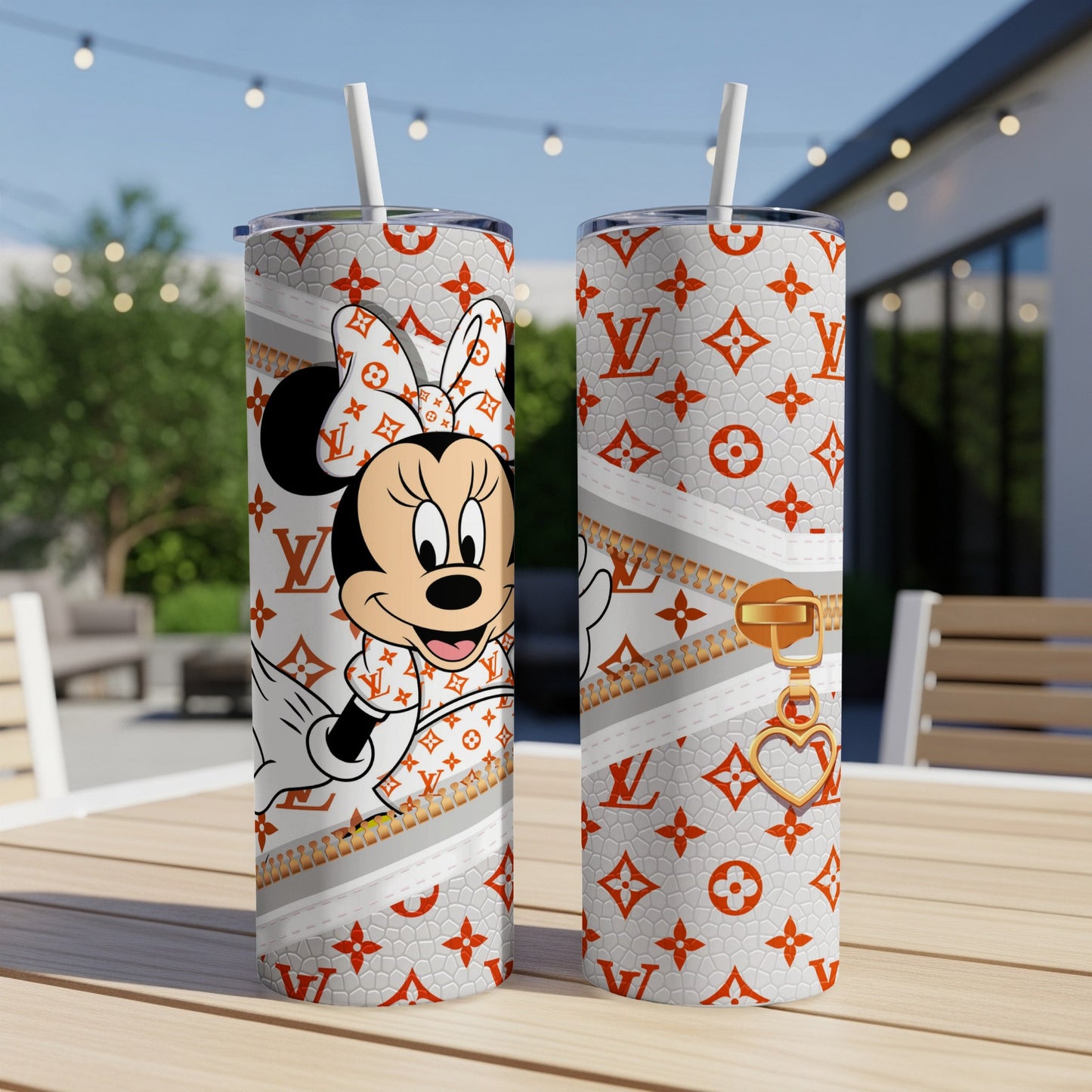 Minnie Mouse in designer outfit on white tumbler with gold zipper and heart charm.