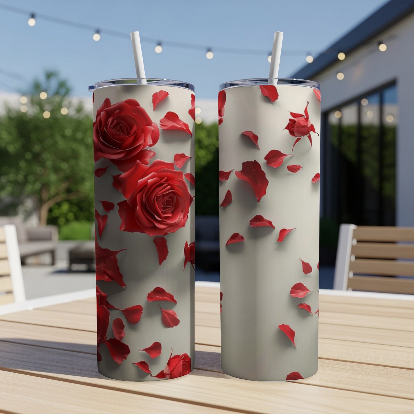 Two tall tumblers with red rose petals scattered on a light background.